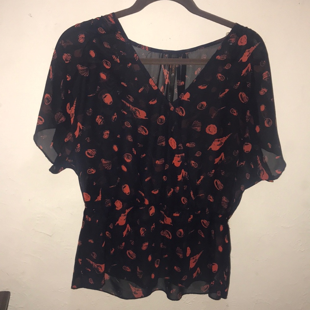 Sheer blouse with seashells